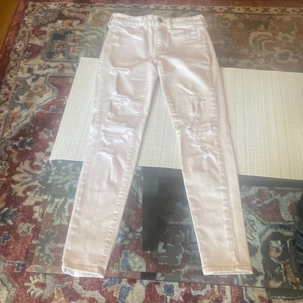Stressed jeans in good condition, size 04, pale rose ,